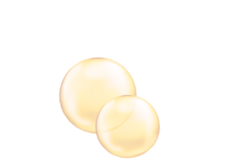 Deux capsules dorées Q10 sur fond blanc