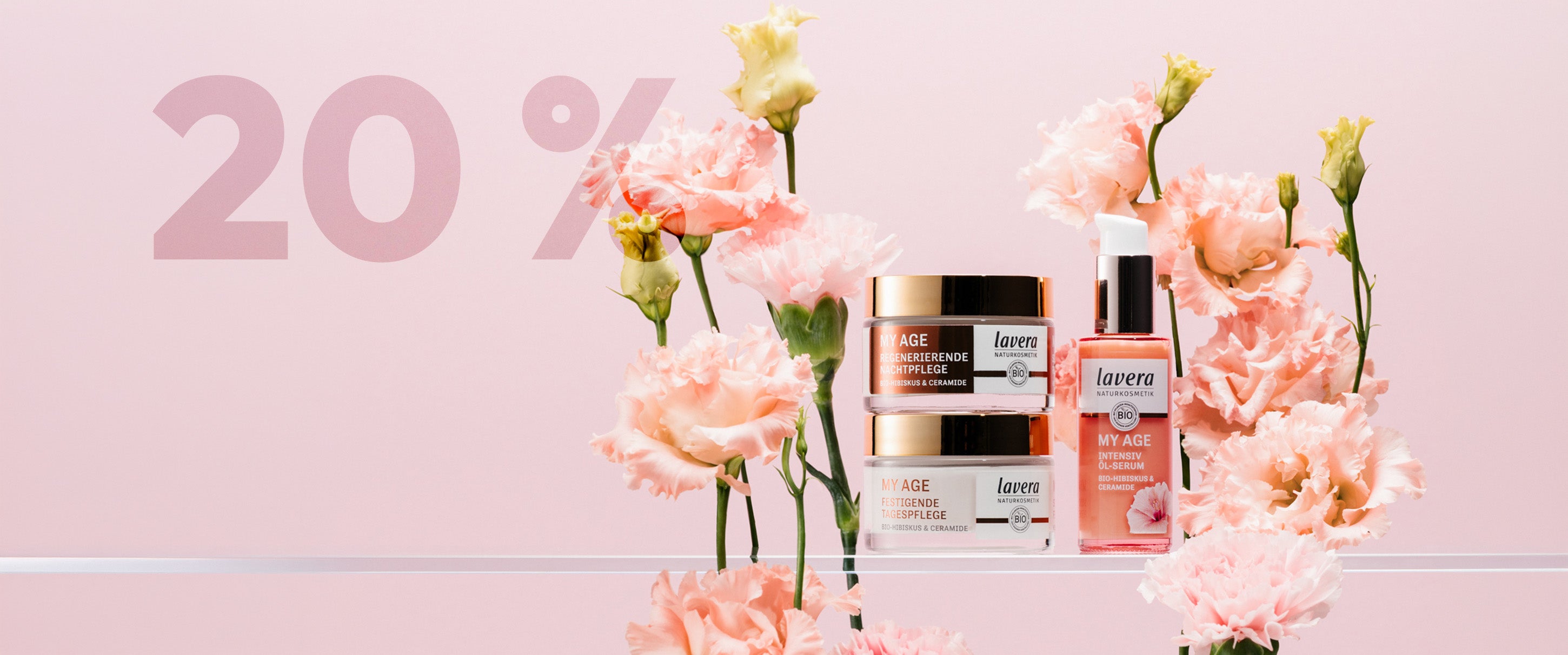 My Age Produkte vor lila Hintergrund umgeben von rosa Rosen